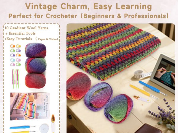 Crochet blanket kit with gradient yarn skeins, hooks, and tutorial book on a wooden surface.
