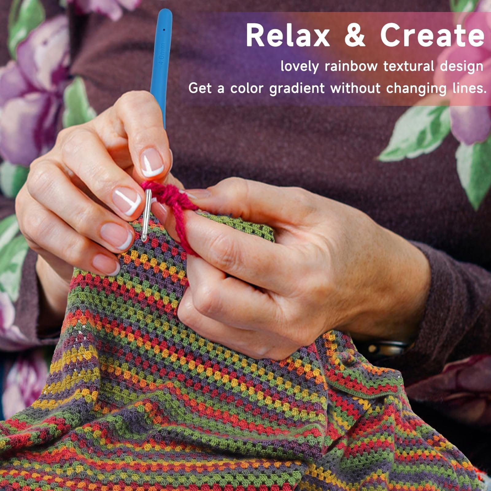 Hands crocheting a colorful striped blanket with a blue 4.0mm hook and red yarn.