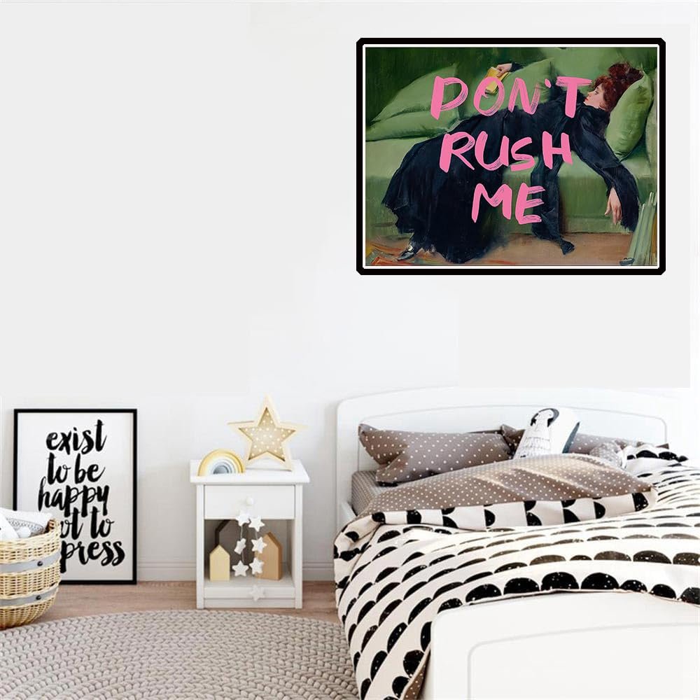 Bedroom scene with a framed painting of a woman on a green couch with pink text "DON'T RUSH ME" above her.