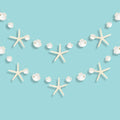 Two strings of white starfish and seashell garland against a blue background. Each string has alternating starfish and shell cutouts.