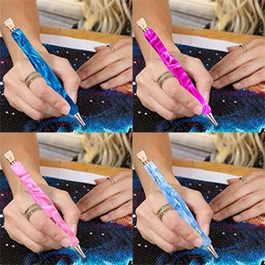 Four hands holding diamond painting pens in blue and pink marble patterns, working on diamond art canvases.