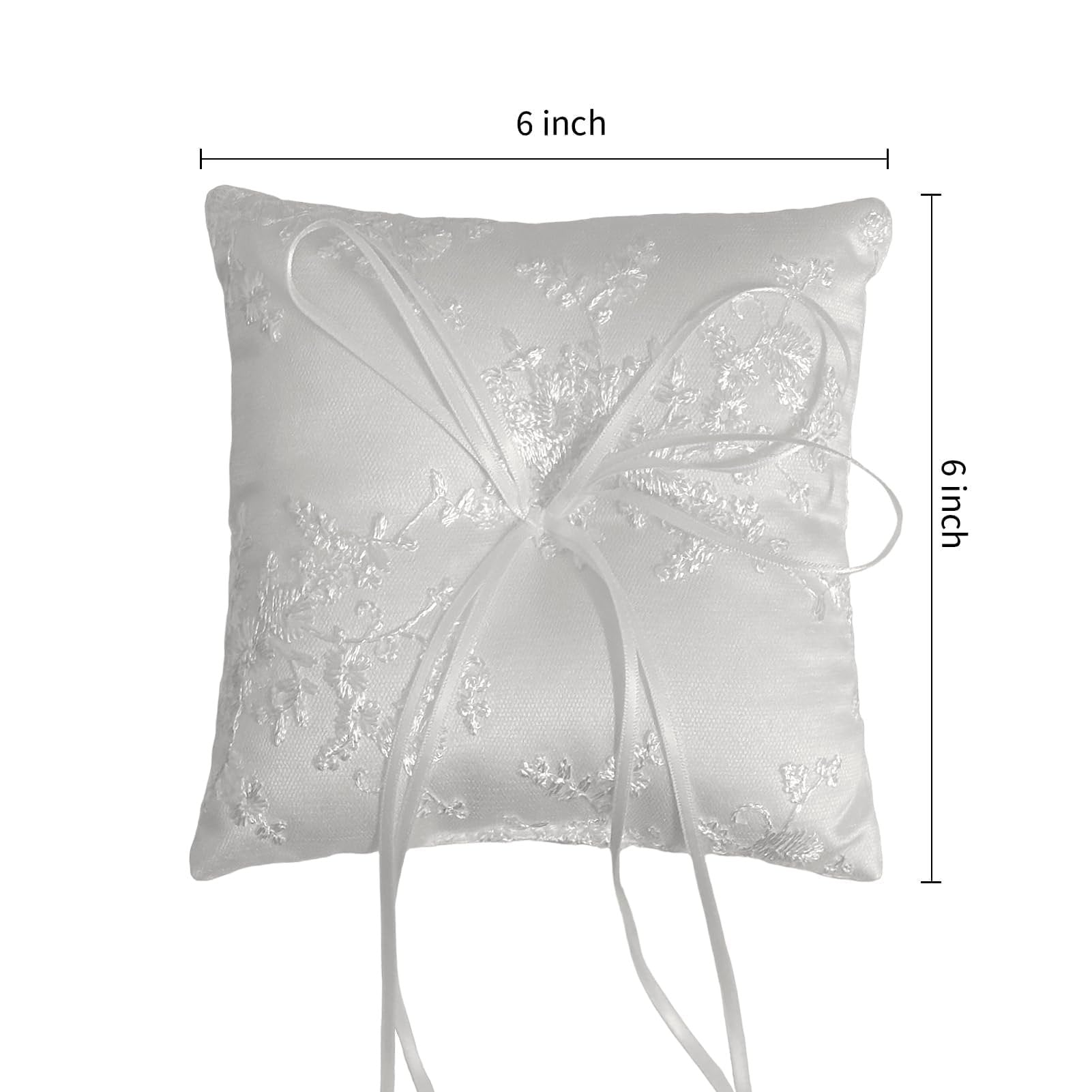 White satin ring bearer pillow with floral lace embroidery and ribbon bow, shown with 6-inch dimensions indicated.