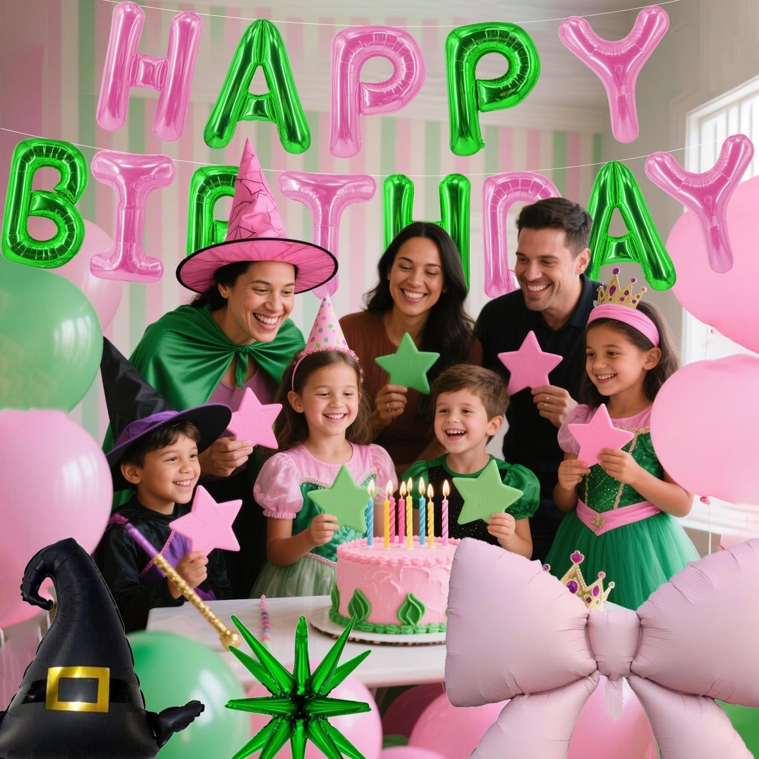 Family celebrating a birthday with green and pink balloons, a cake, and witch-themed decorations.