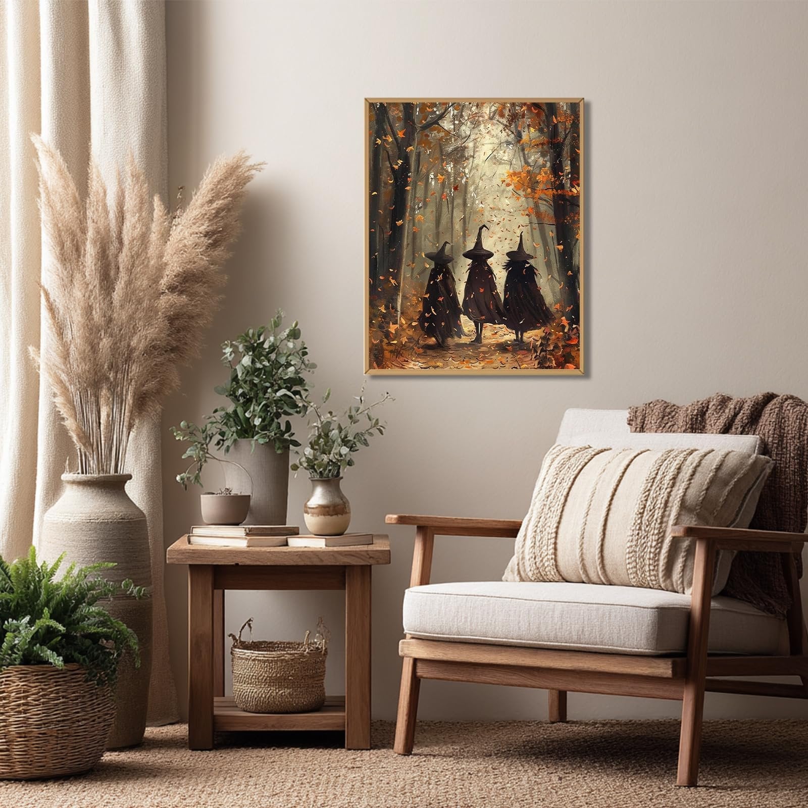 Framed painting of three witches walking in an autumn forest, displayed in a living room setting.