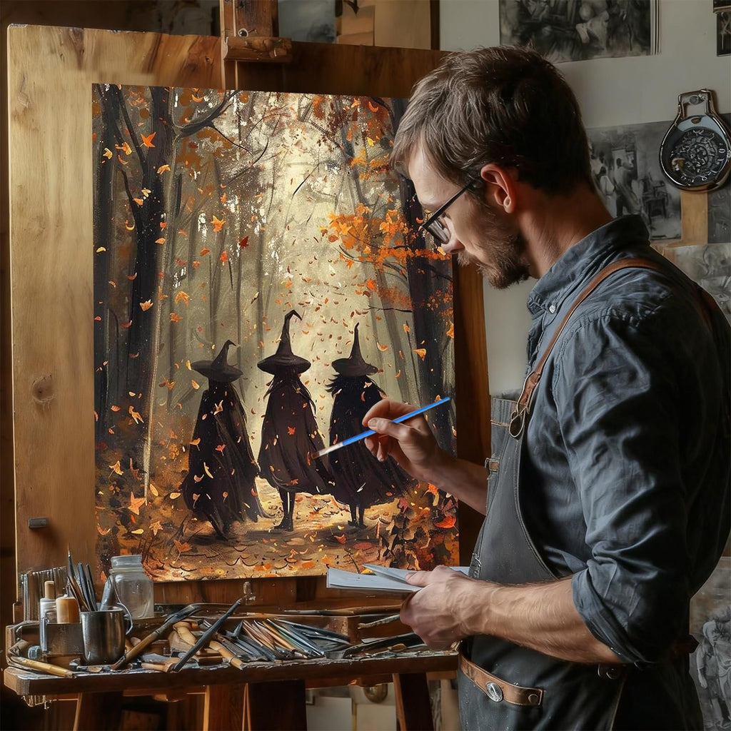 Artist painting a witch-themed fall forest scene on canvas, holding a brush and palette.