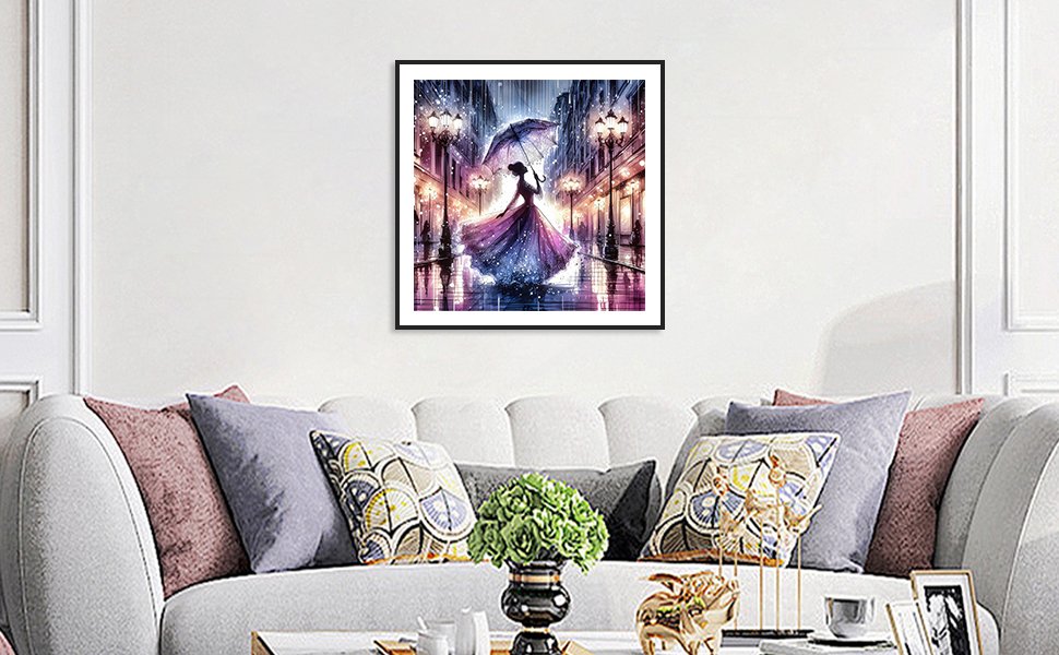 Framed 5D diamond painting of a woman in a purple dress holding an umbrella on a rainy city street at night.