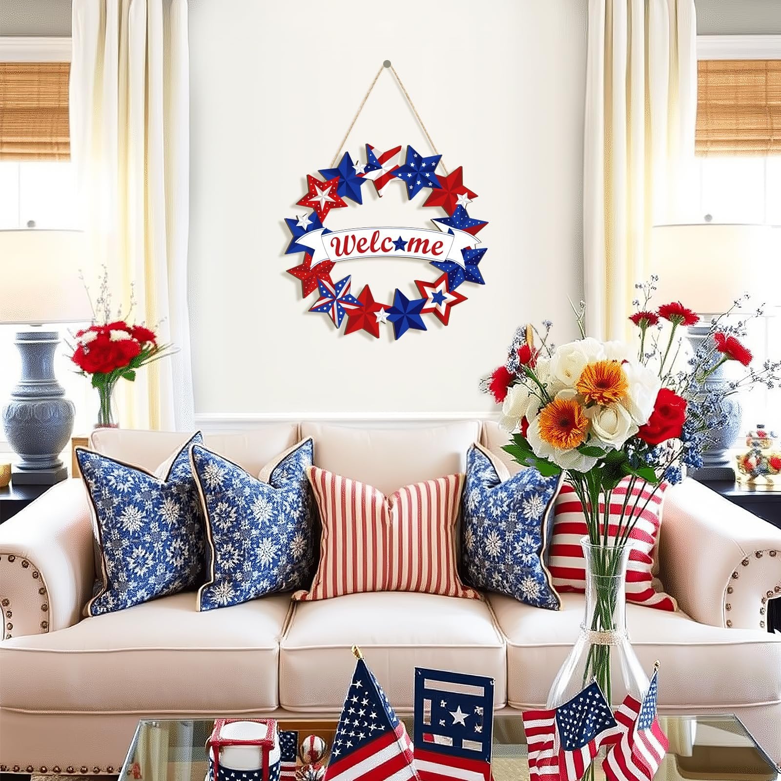 Wooden star wreath with 'Welcome' banner hanging on a wall above a sofa with patriotic decor.