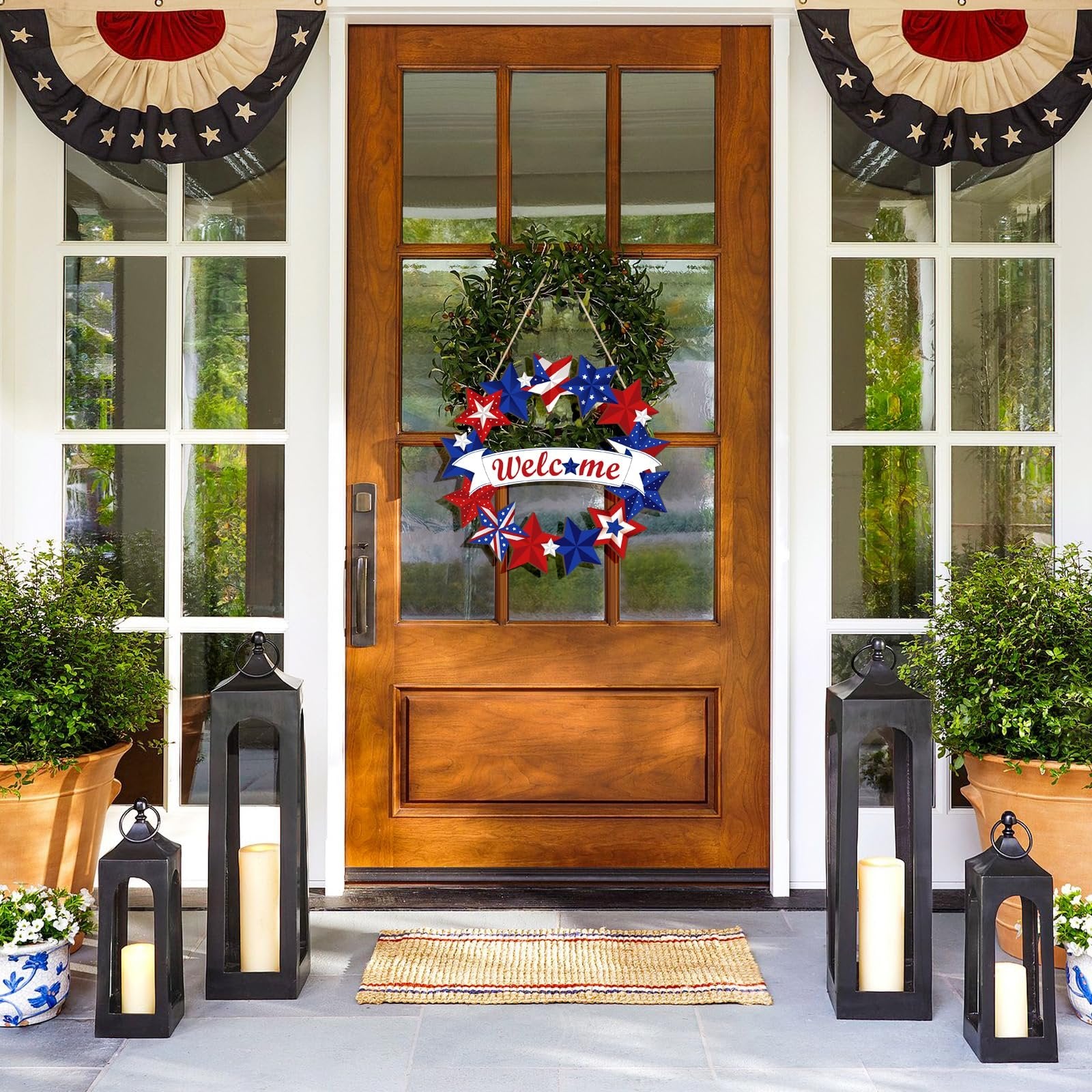 Front door decorated with a patriotic wreath and star banner, flanked by plants and lanterns.