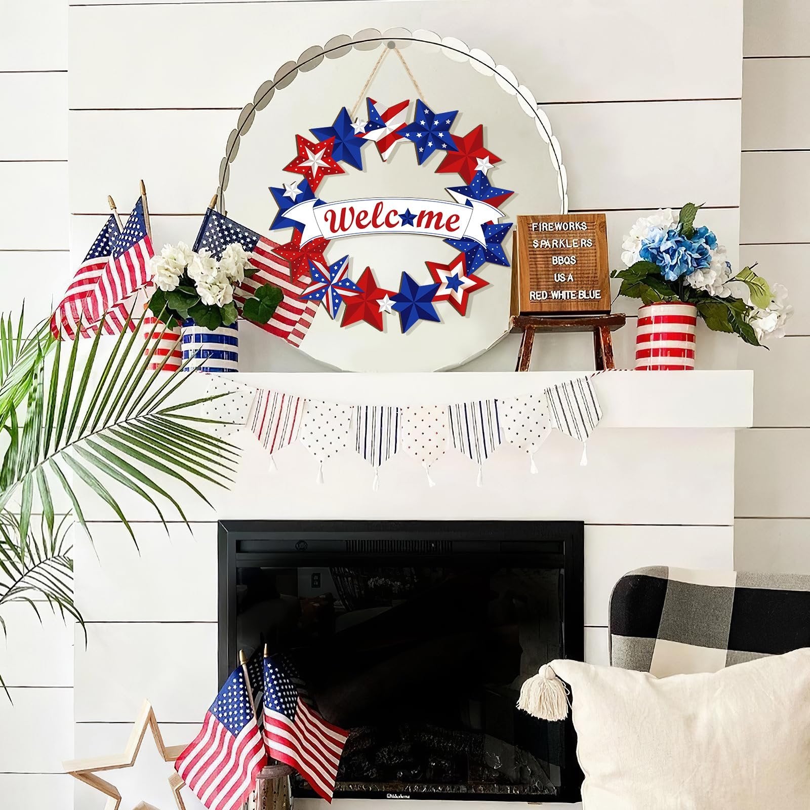 Fourth of July themed mantelpiece with a star wreath, American flags, and floral arrangements.