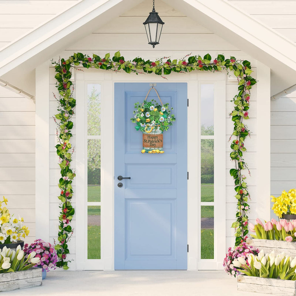 Wooden St. Patrick's Day hanging sign with shamrocks and flowers, on a blue door with floral garlands.