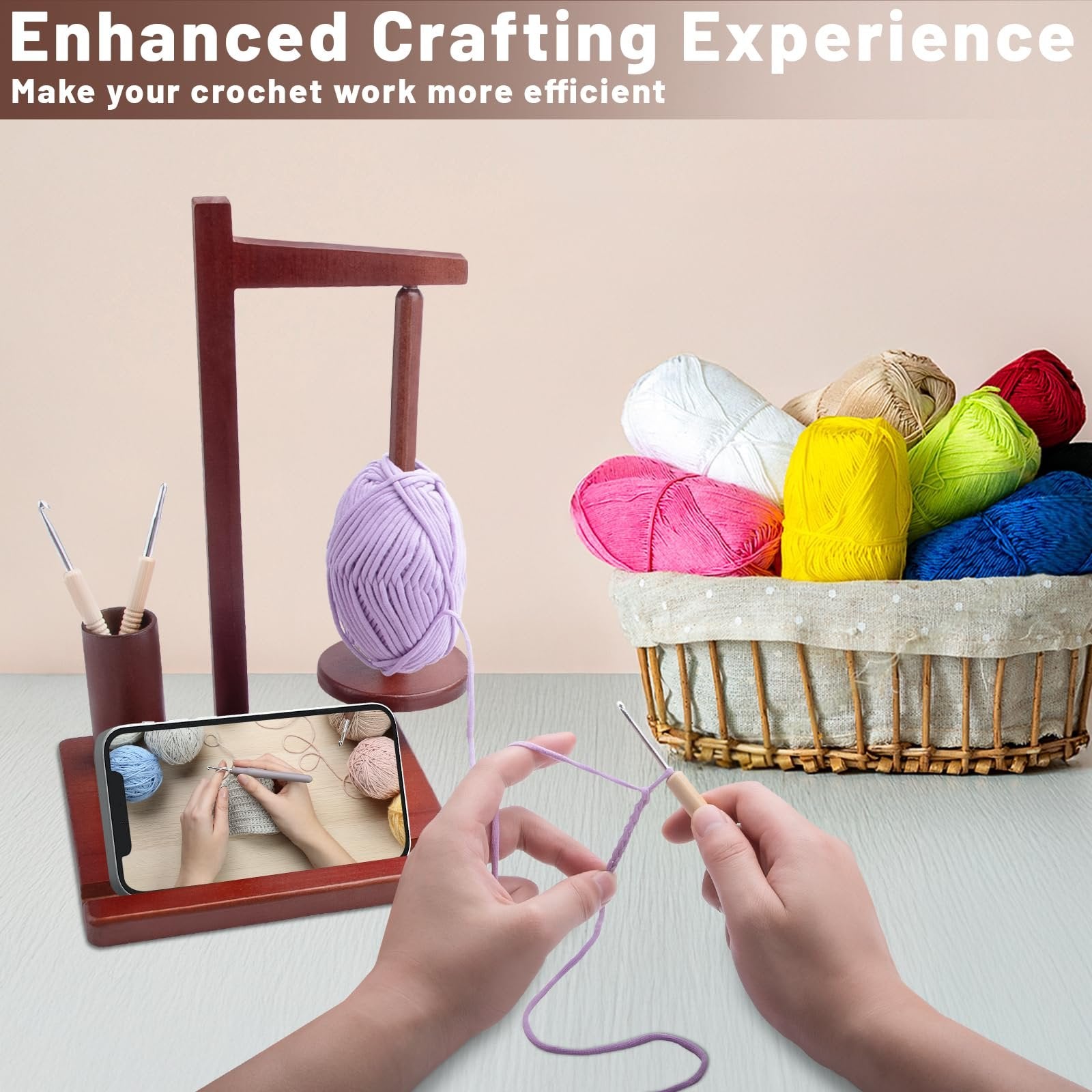 Wooden yarn holder with purple yarn, basket of colorful yarn, crochet hooks, and phone displaying crochet tutorial
